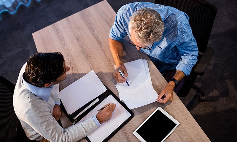 Men reviewing paperwork