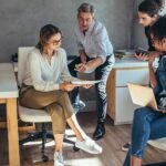 People in an office next to the Xerox® VersaLink® B620 printer